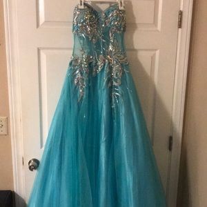 Full length light blue prom dress.